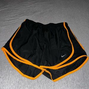 Black and orange nike athletic shorts